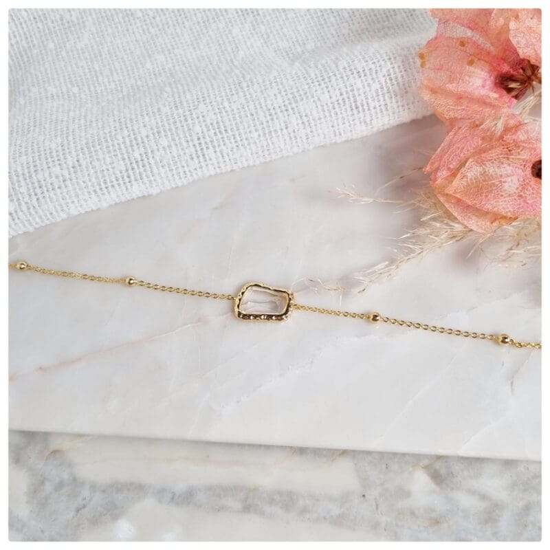 Pulseira dourada bolinhas e cristal transparente