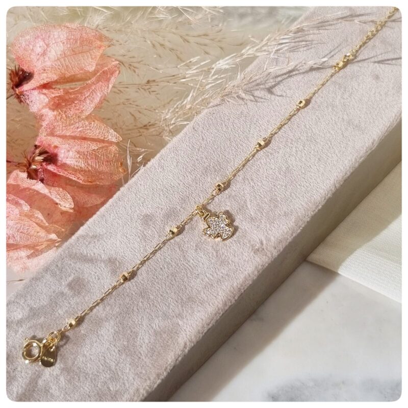 Pulseira infantil com bolinhas e pingente de anjo